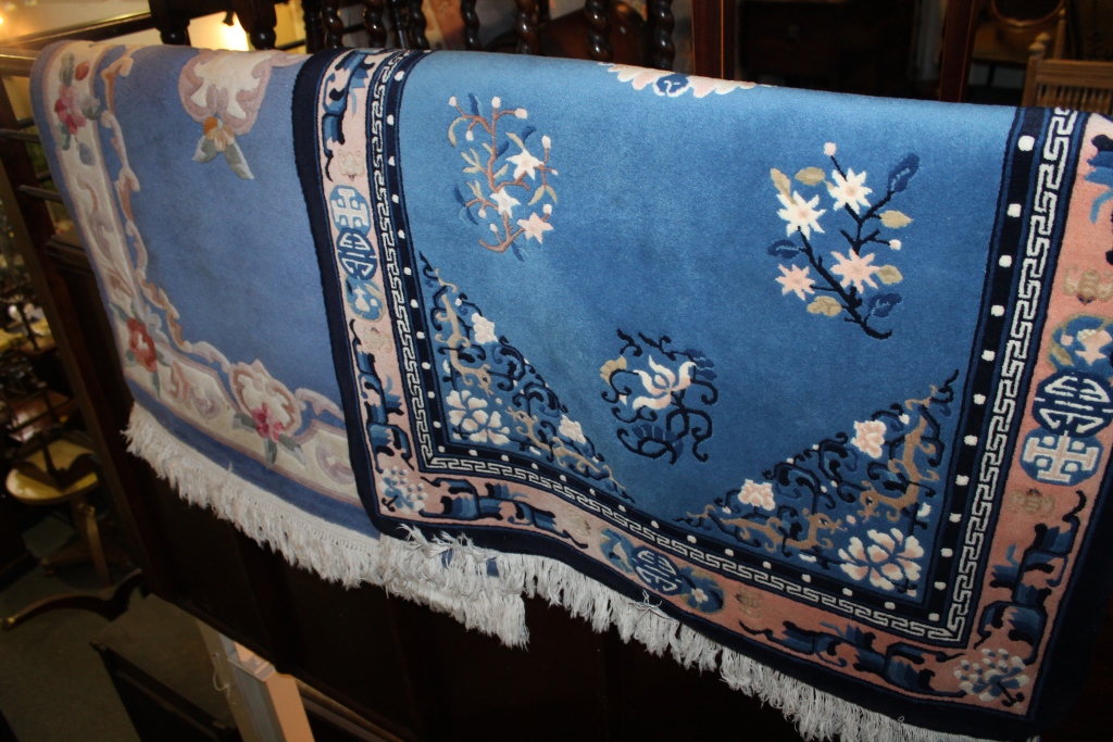 TWO CHINESE BLUE GROUND WASHED RUGS