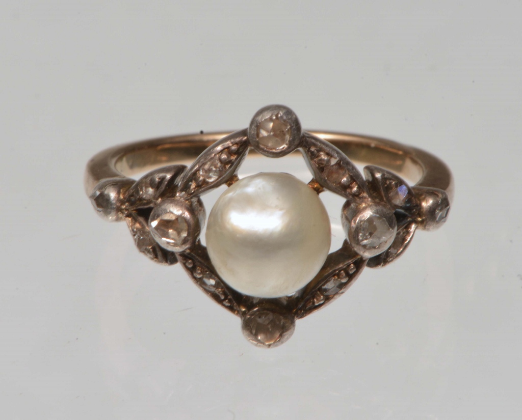 A VICTORIAN PEARL AND DIAMOND SET DRESS RING surrounded by rose cut diamonds in an open square