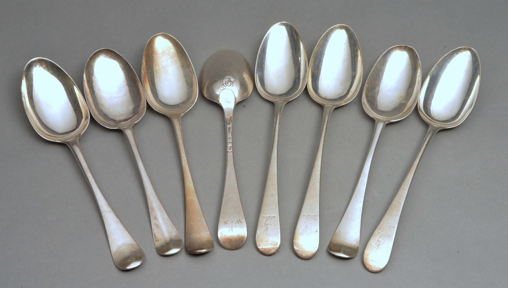 EIGHT 18TH CENTURY SILVER BOTTOM MARKED TABLESPOONS including a lace back spoon, engraved and dated,