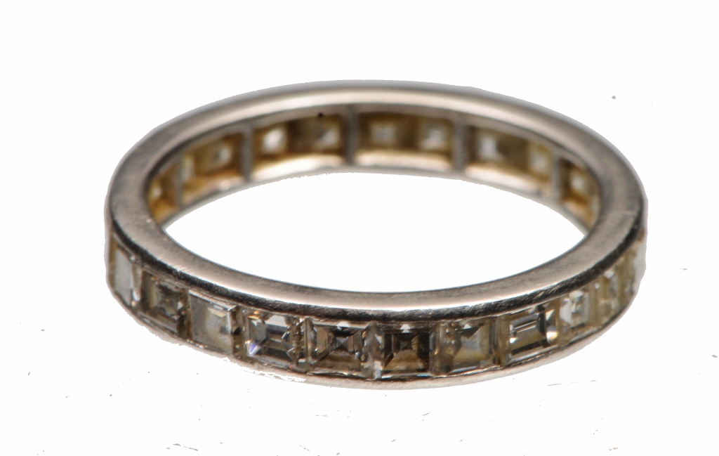 A DIAMOND SET FULL ETERNITY RING set with square cut diamonds