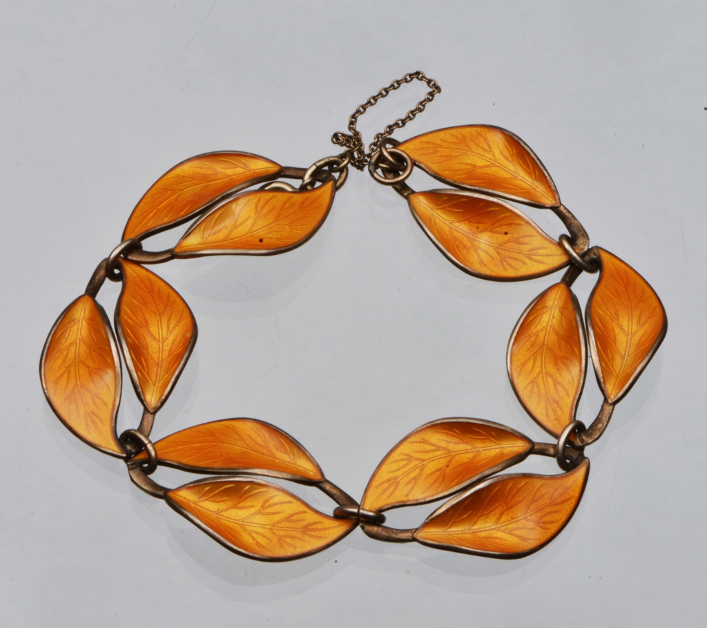 A SCANDANAVIAN SILVER AND ENAMEL DOUBLE LEAF LINKED PANEL BRACELET with orange enamel by David