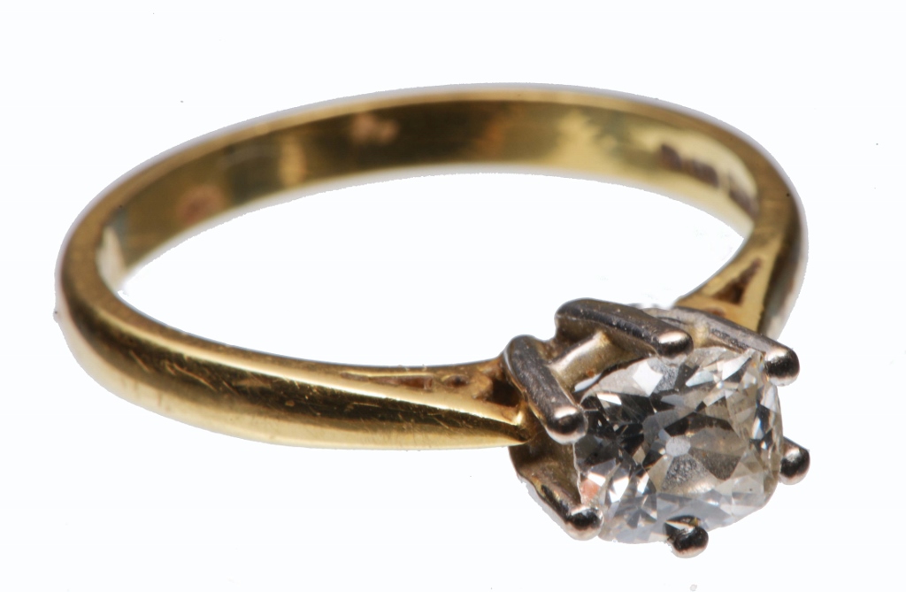 A DIAMOND SET SOLITAIRE RING, claw set old cushion cut diamond mounted in an 18ct yellow and white