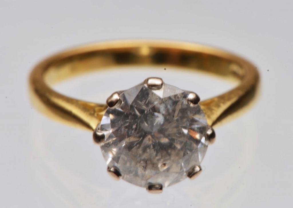 A DIAMOND SET SOLITAIRE RING, brilliant cut diamond with a calculated measurement of three carats,