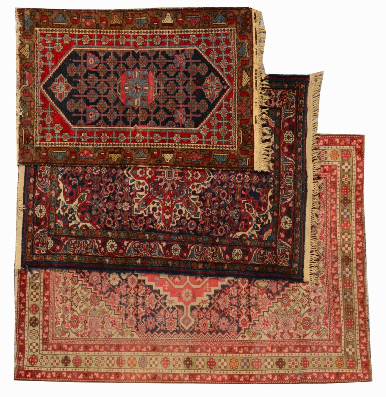 AN EASTERN CAMEL GROUND RUG with a central red ground medallion and multiple border, 1.86m x 1.26m;