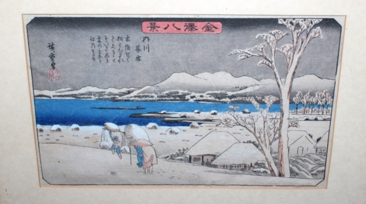 A JAPANESE COLOURED PRINT of a winter scene with three figures trudging through snow, 22cm x 35cm,