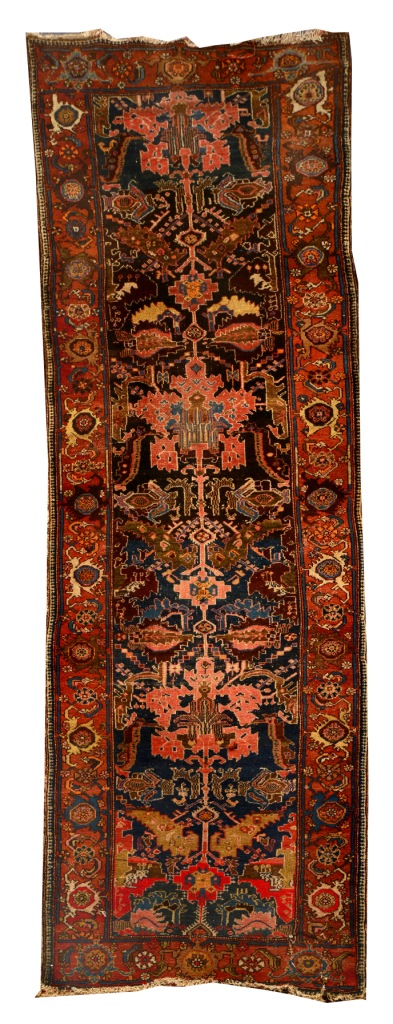 A KURDISH BROWN GROUND RUNNER, the central inter linked stylised design and flower head border, cut