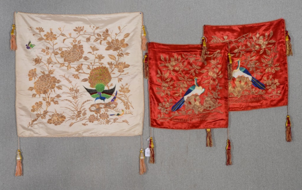 A PAIR OF JAPANESE RED SILK GIFT COVERS each decorated an oriental pheasant and another with