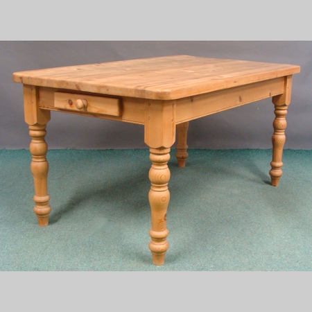 A pine dining table, with a single drawer, 151 x 89cm