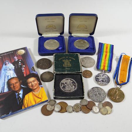 A collection of coins and medals, to include WWI medals