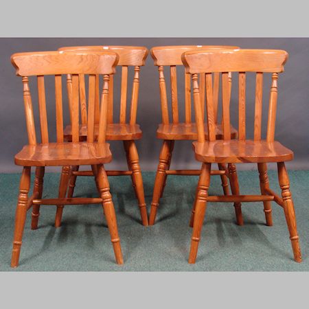 A set of four pine kitchen chairs