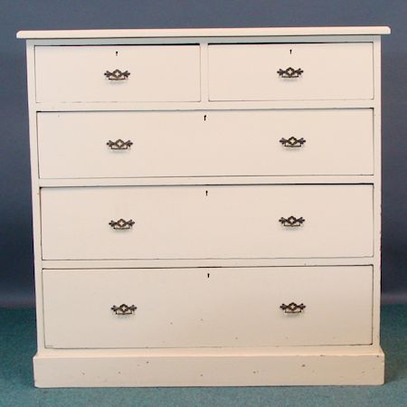 A white painted chest of drawers, containing two short over three long drawers, on a plinth base