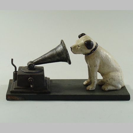 A cast iron HMV dog with a gramophone, 10cm tall