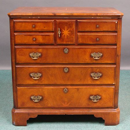 A reproduction Norfolk chest style walnut cabinet, 86cm