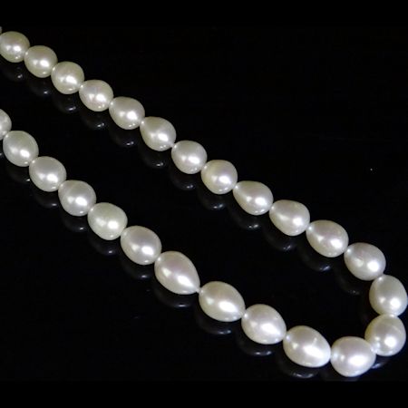 A cultured pearl single strand necklace, boxed