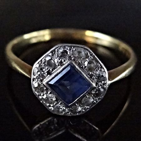 An 18 carat gold, sapphire and diamond cluster ring