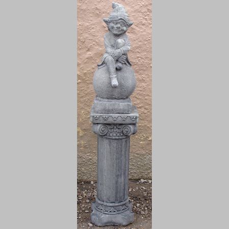 A reconstituted stone model of a leprechaun, on a column base, 115cm tall