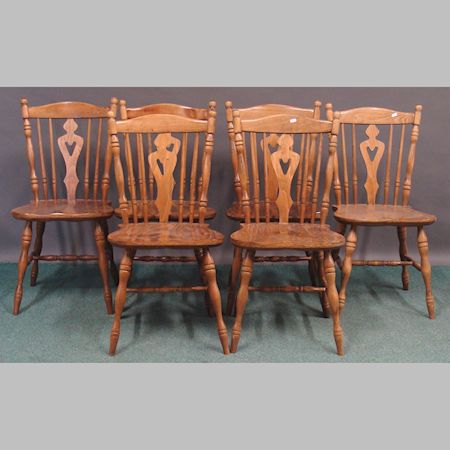 A set of six spindle back dining chairs, on turned legs