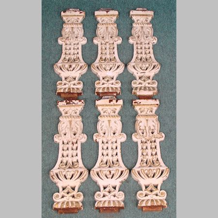 A set of six Victorian white painted cast iron balustrades, 53cm tall