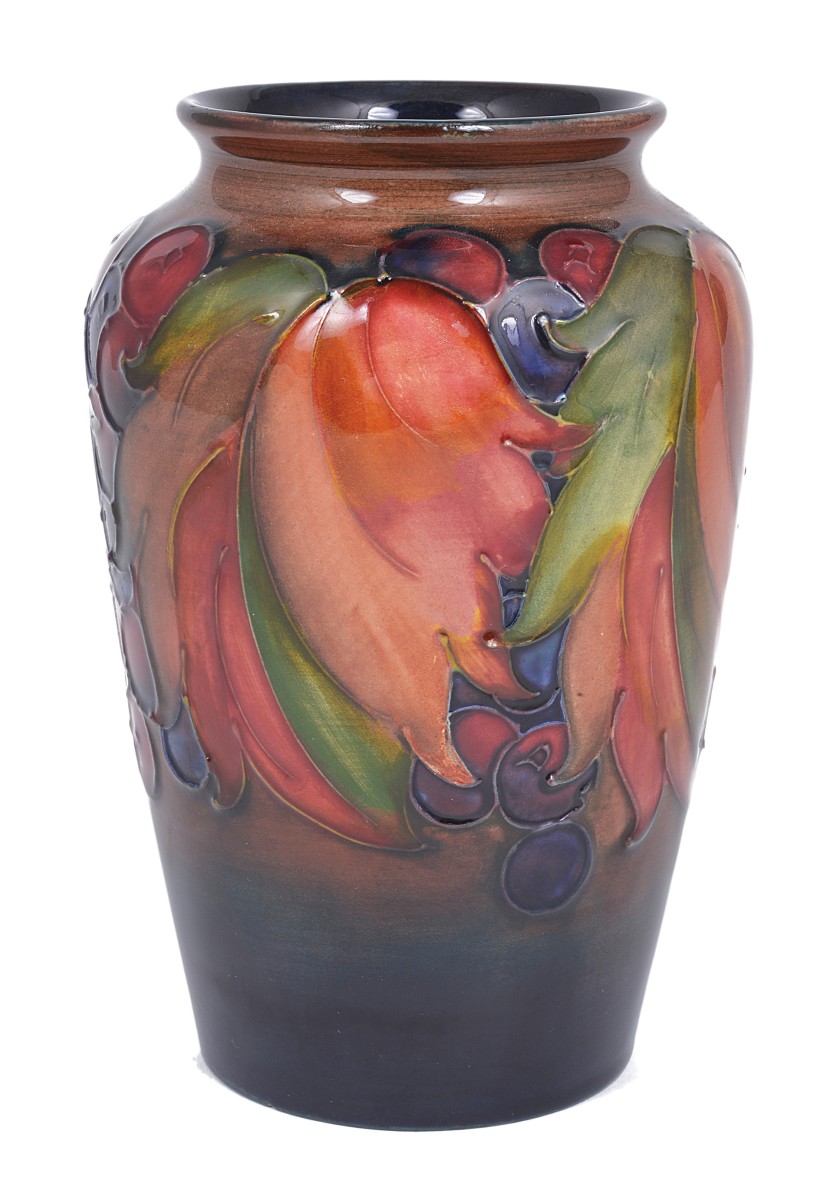 LEAF AND BERRY: A SLENDER OVOID MOORCROFT FLAMBÉ VASE, CIRCA 1930 tube lined with fruit and foliage,