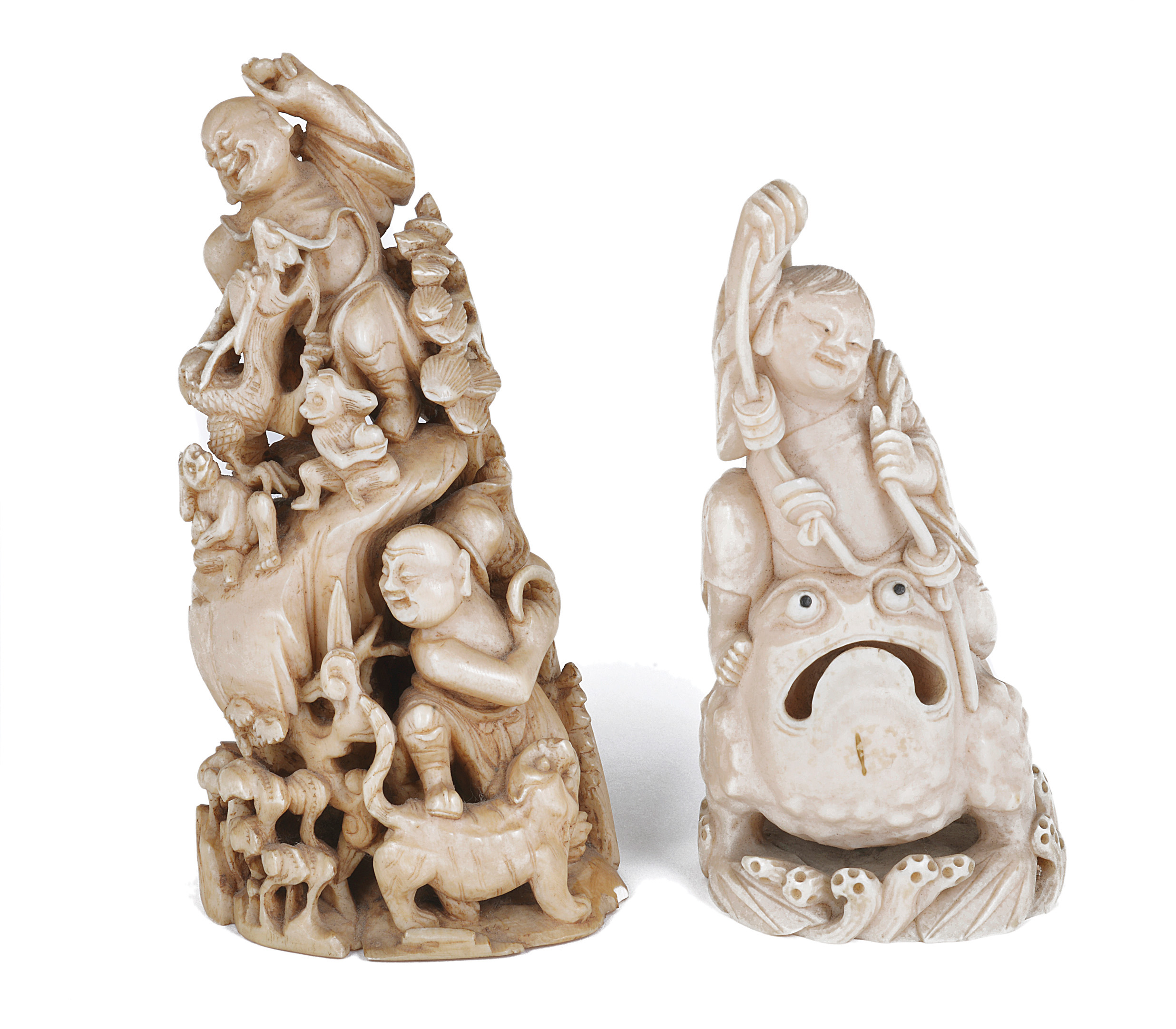 TWO CHINESE IVORY CARVINGS, LATE QING one carved with two figures on a rock with pine trees,