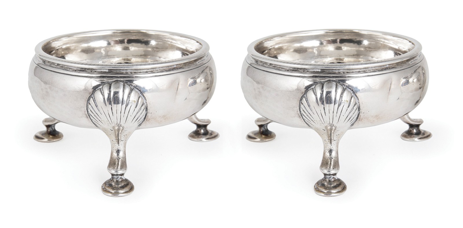 A PAIR OF GEORGE III SILVER SALT CELLARS, DAVID MOWDEN, LONDON, 1763 each on three shell-headed