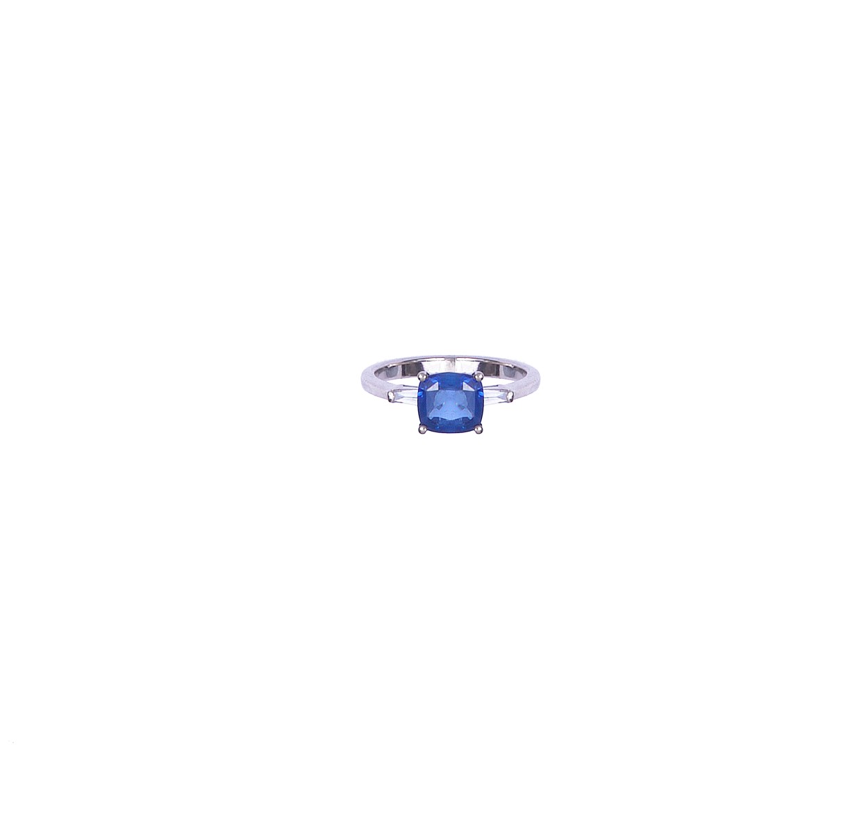 SAPPHIRE AND DIAMOND RING the cushion-shaped sapphire between tapering baguette shoulders size O