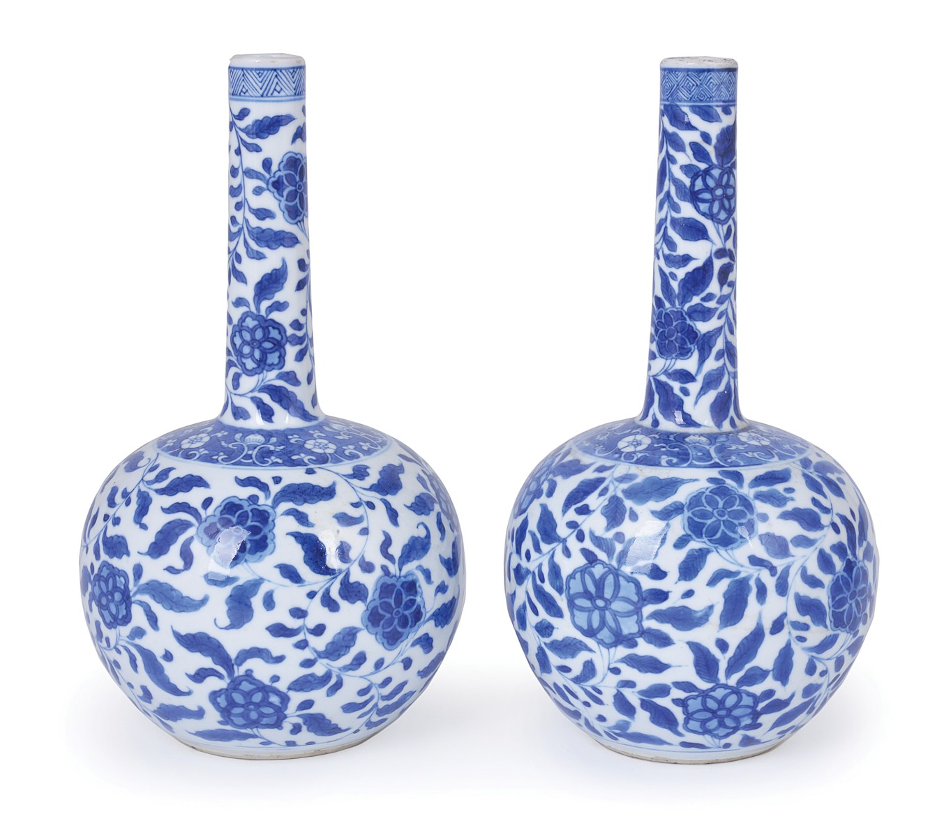 A PAIR OF CHINESE PORCELAIN BLUE AND WHITE `G` MARK BOTTLE VASES, KANGXI (1662-1722) with long