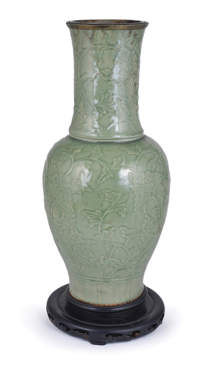 A CHINESE LONGQUAN CELADON BALUSTER VASE, YUAN/MING covered in leafy sprays in relief, the base with