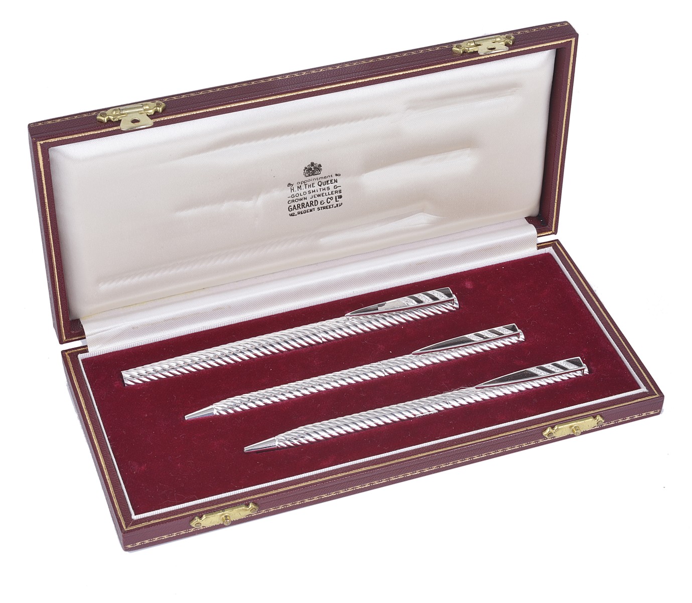 A CASED SET OF THREE WHITE GOLD AND DIAMOND-SET PENS, RETAILED BY GARRARD & CO LTD, LONDON, 1978