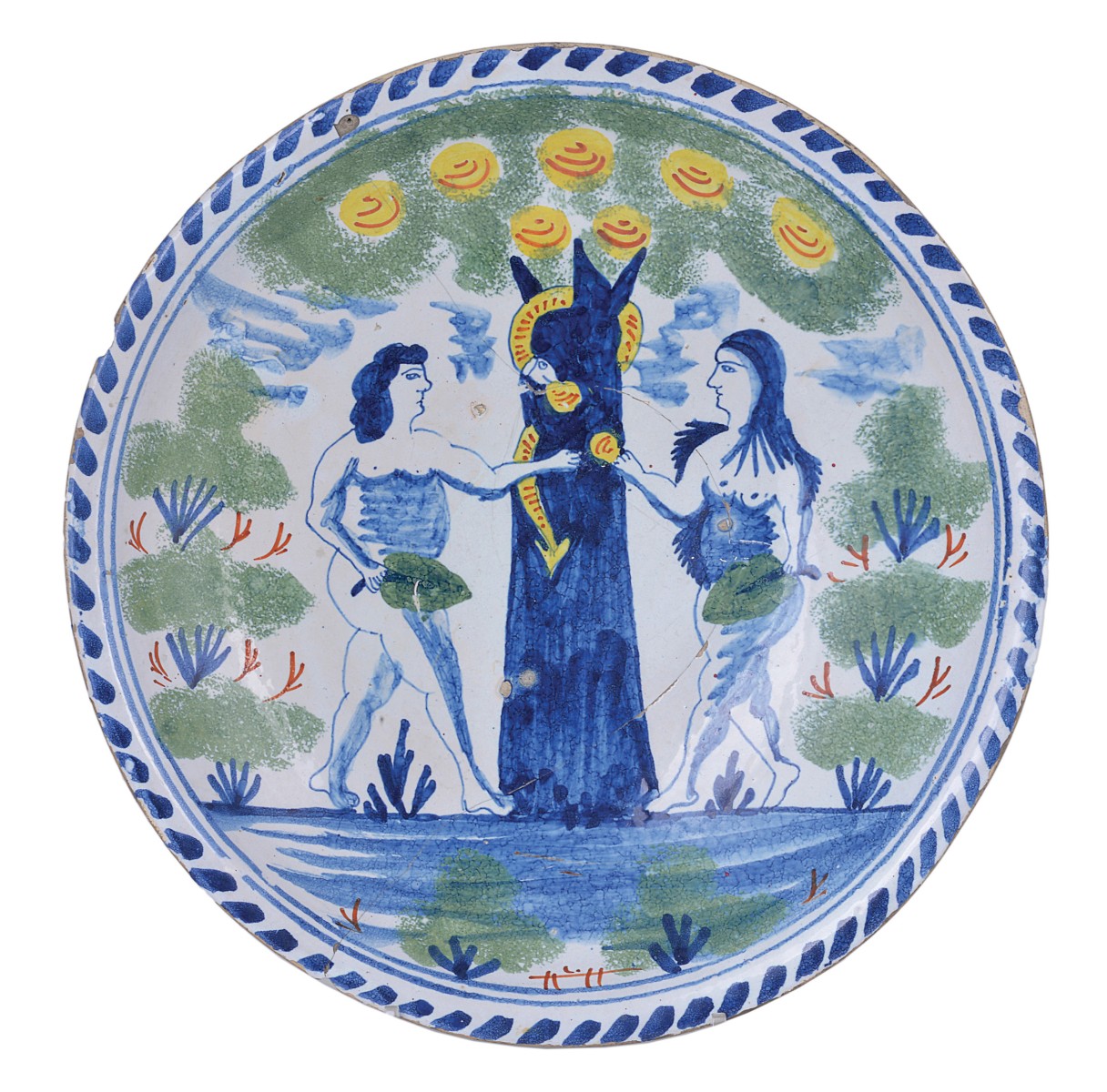 A BRISTOL DELFTWARE ADAM AND EVE CHARGER, EARLY 18TH CENTURY painted and sponged in blue, green,