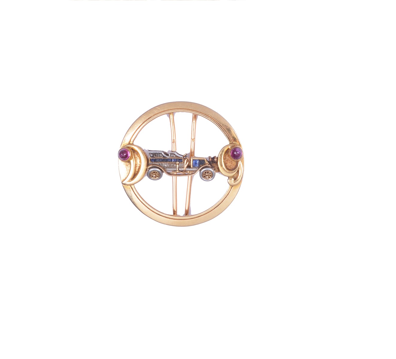 SAPPHIRE, RUBY AND DIAMOND CLIP BROOCH, CHAUMET the open annular brooch with central car motif set