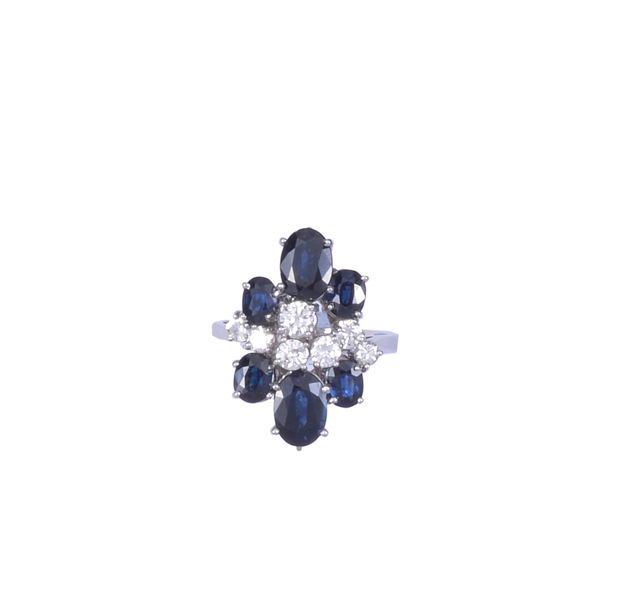 SAPPHIRE AND DIAMOND RING, 1960s of asymmetric design set with a central row of brilliant-cut