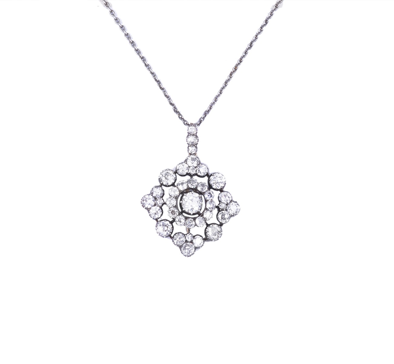 DIAMOND PENDANT, 1880s of quatrefoil design set throughout with cushion and circular-cut diamonds,