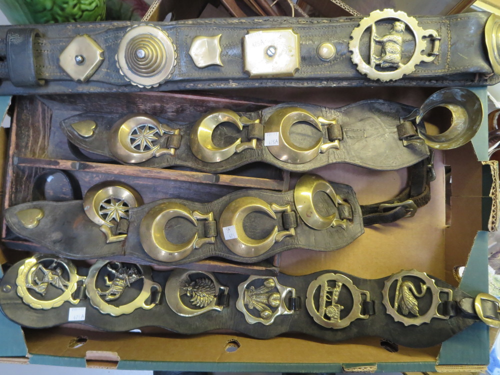 A selection of horse brasses and a cutlery box