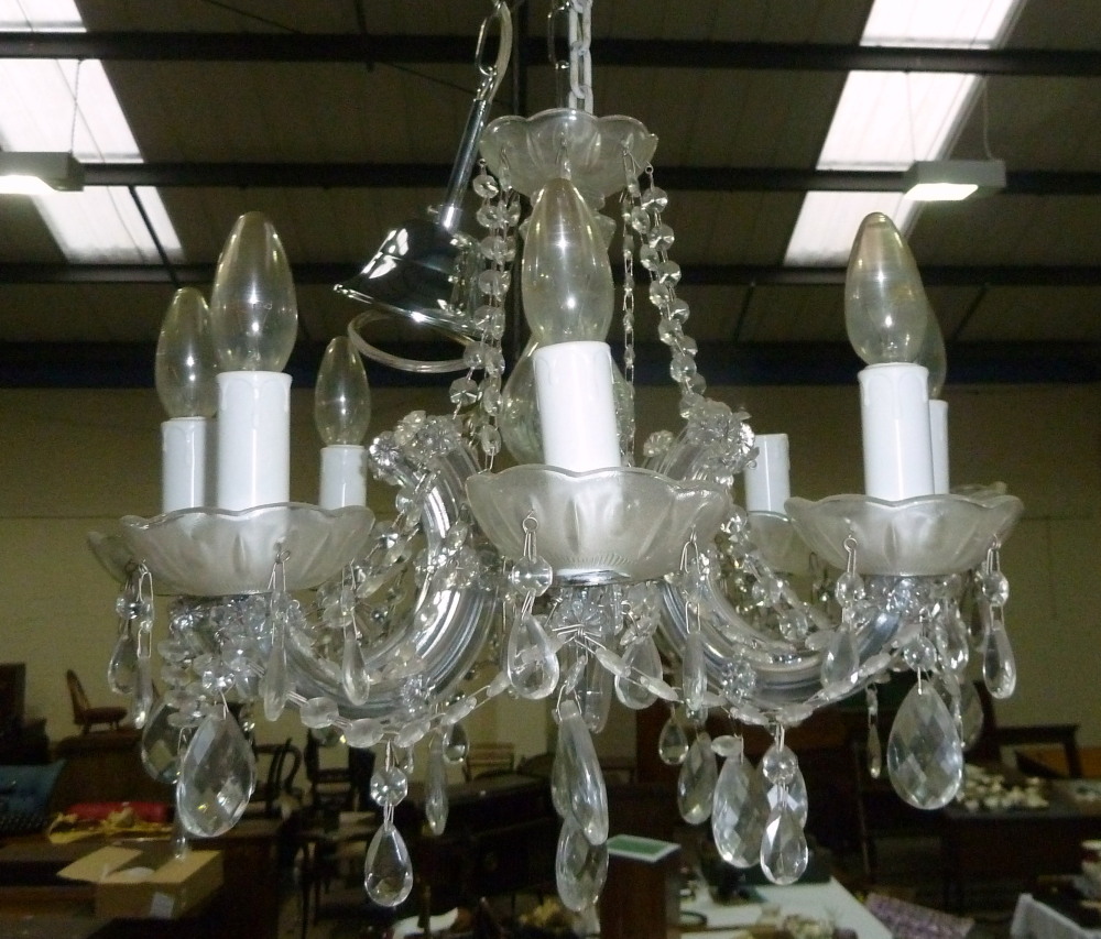 A Victorian style 8-branch glass chandelier with faceted drops