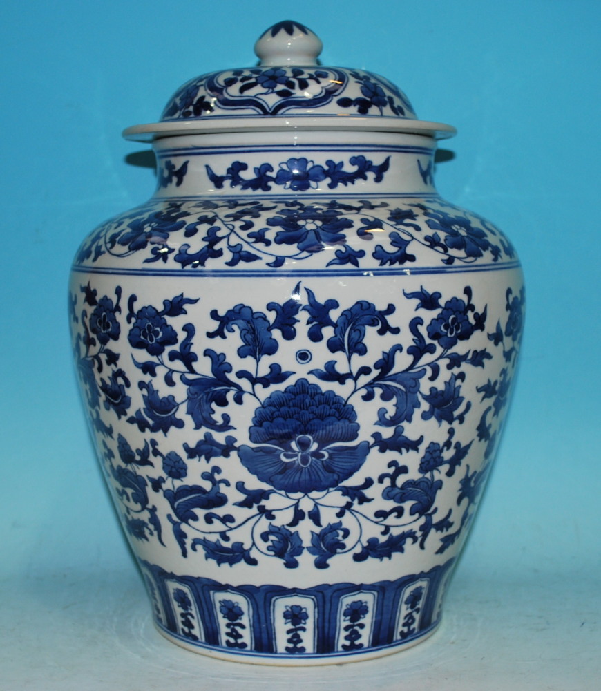A Chinese blue and white covered baluster vase decorated with stylized flowers and leaves, 6