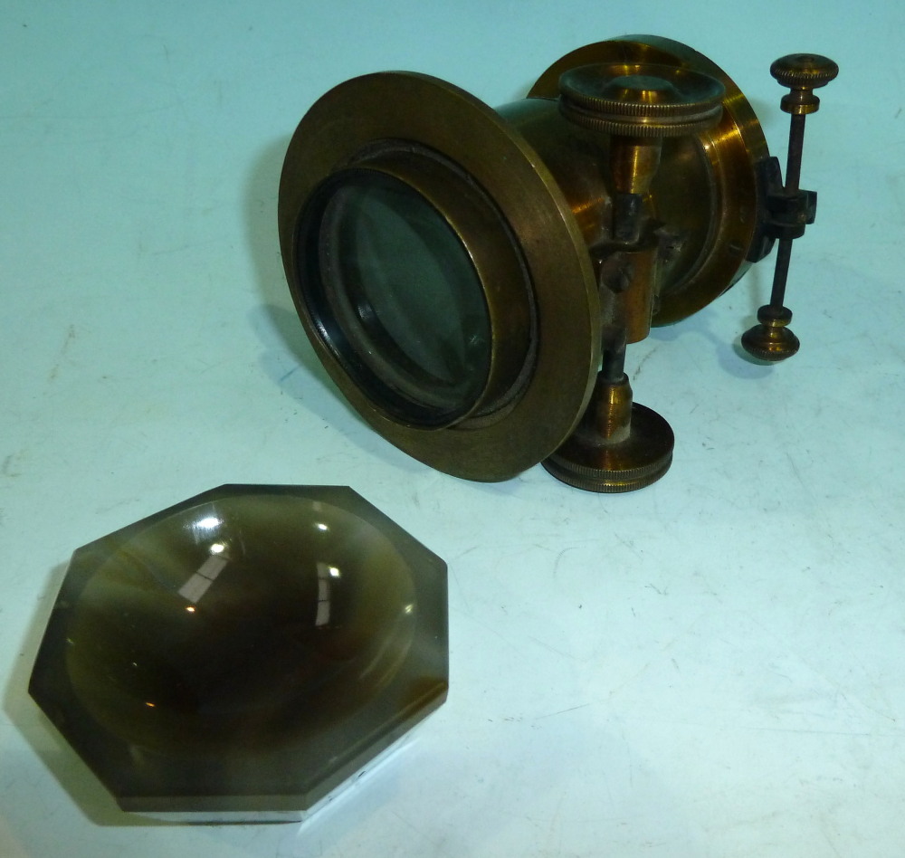 A small polished agate mortar and a magic lantern lens