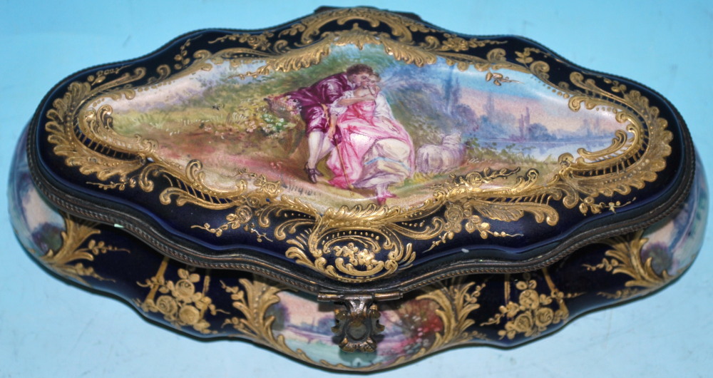 A 19th century Sèvres porcelain shaped oval cushion form casket decorated with enamelled scenes,