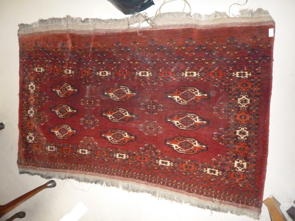 A Tekke Bokhara rug, 66" x 43" (including fringe)