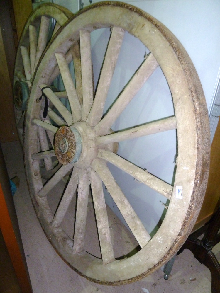A pair of 19th century wagon wheels reputed to be from a London Fire Engine by Shand Mason & Co,