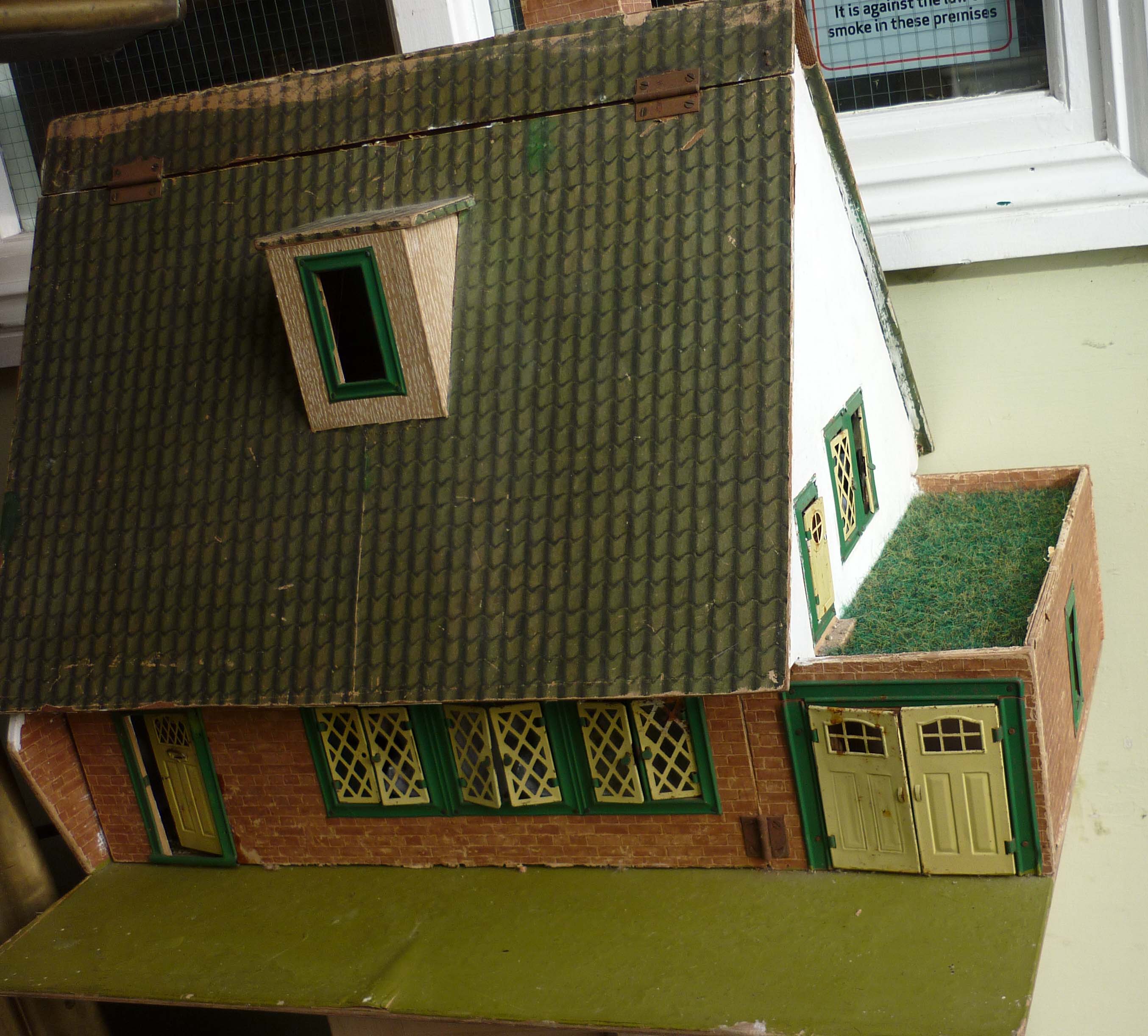Doll`s house and attached garage with tinplate windows and doors 22” high