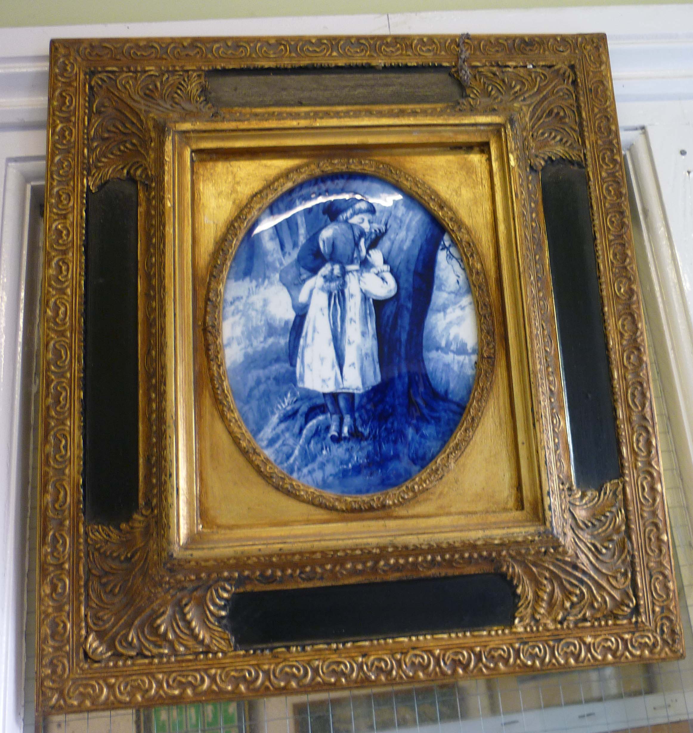 Framed blue and white ceramic pictorial plaque