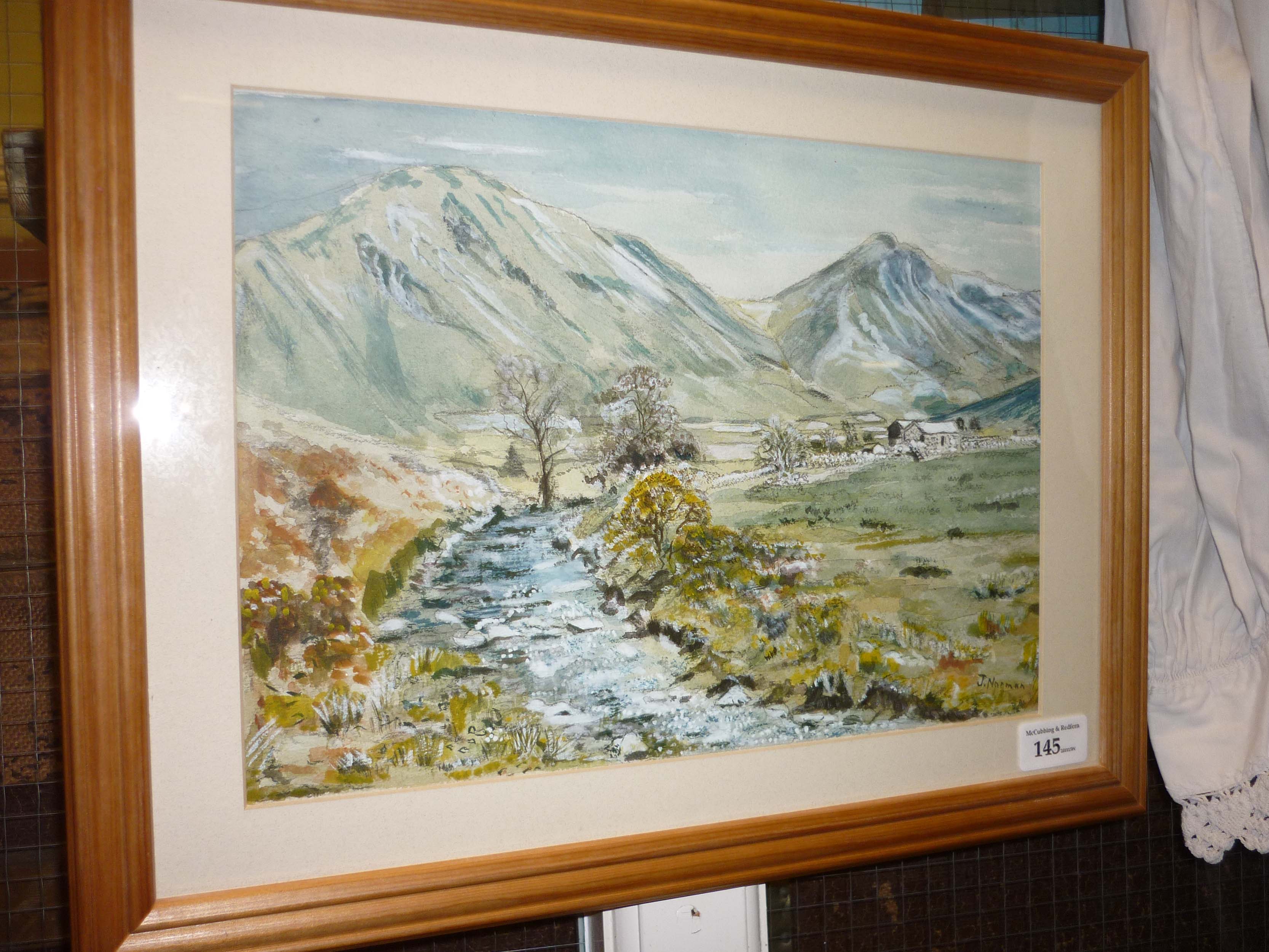 Framed watercolour of river scene with mountainous background signed J. Norman