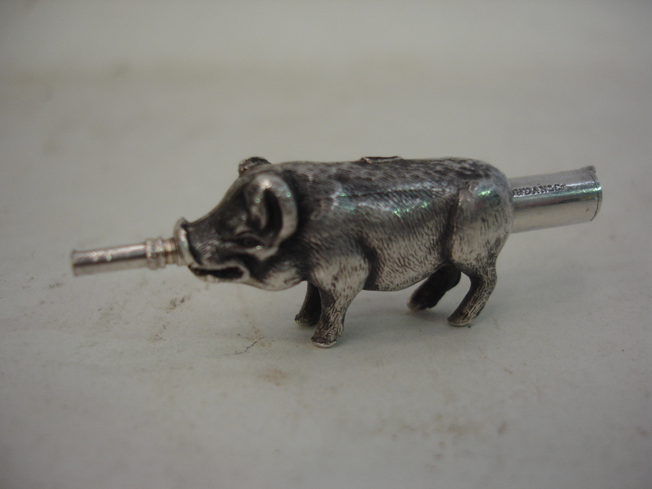 A Samson Morden white metal pig propelling pencil (tail probably lacking) 2" long extended