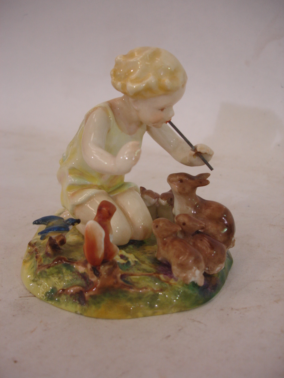 A Royal Worcester figure "A Woodland Dance" modelled by F.G Doughty. No. 3076, 4" high