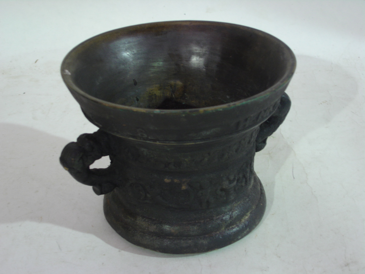 A bronze mortar bearing date 1638, 6" diam