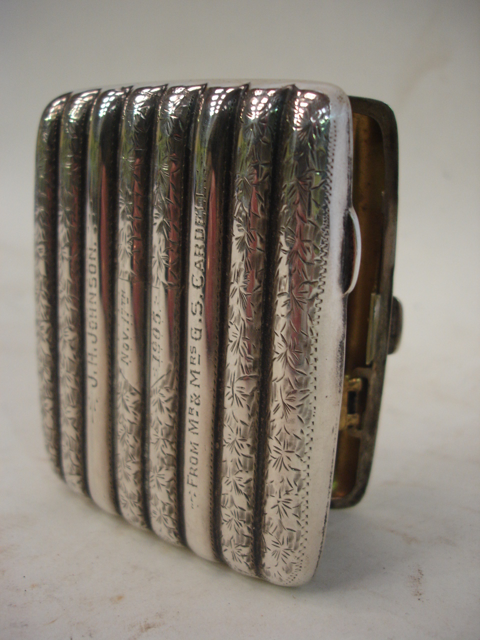 A silver cigarette case, foliate engraved Chester 1905, 3 ½" high