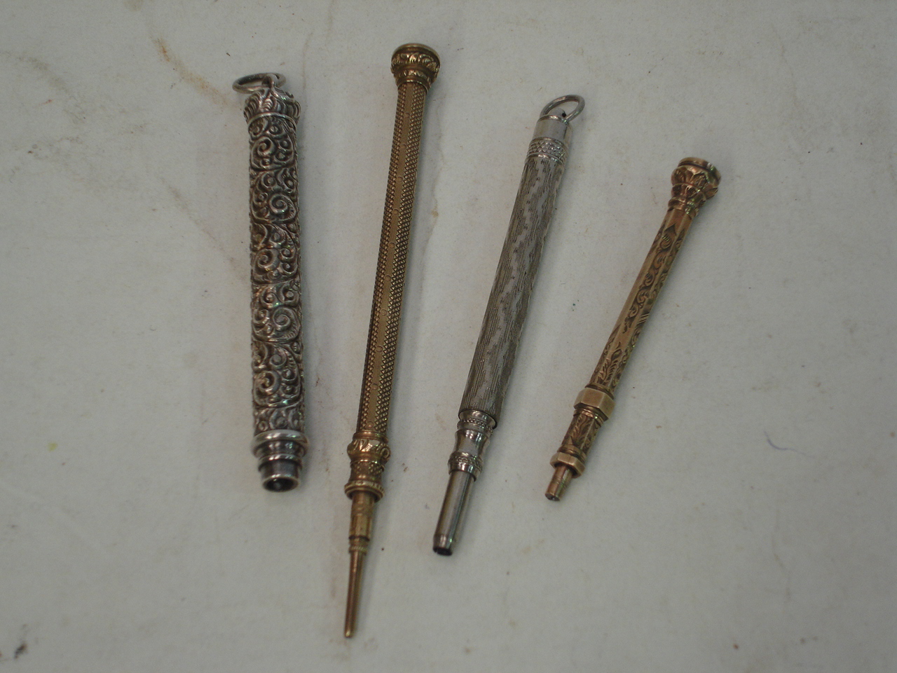 Four propelling pencils