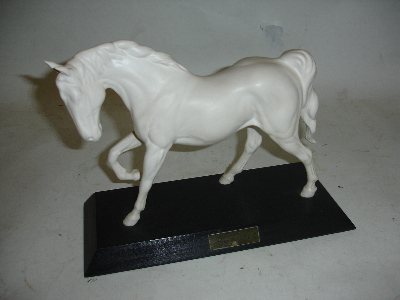 A Beswick matt glazed horse "Spirit of Freedom", raised on plinth. 8" high inclusive