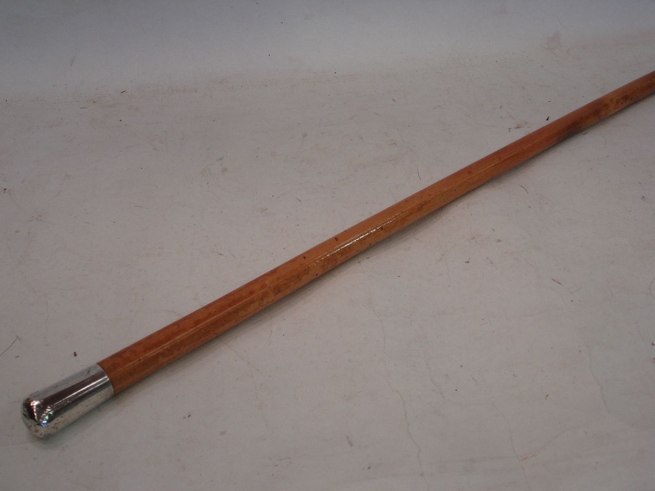 A malacca cane with silver grip, London 1919